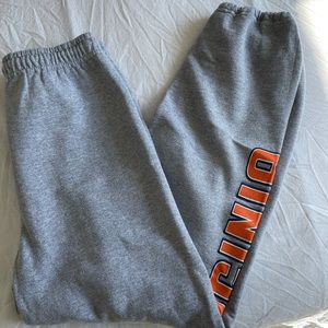 Grey sweatpants that say virginia on the side of them